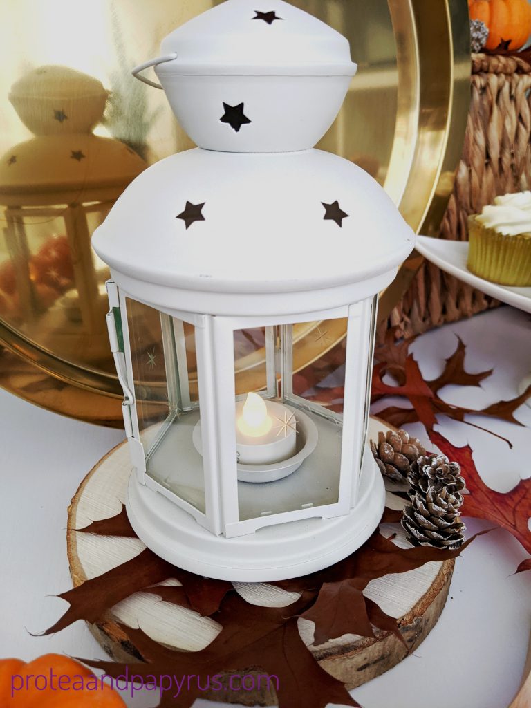 White lantern on a wooden block 