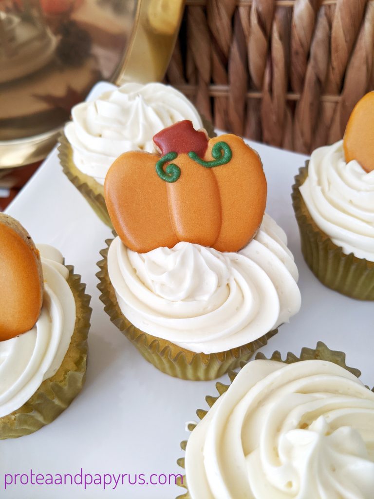 Pumpkin spice cupcakes with swiss meringue buttercream and topped with a sugar cookie 